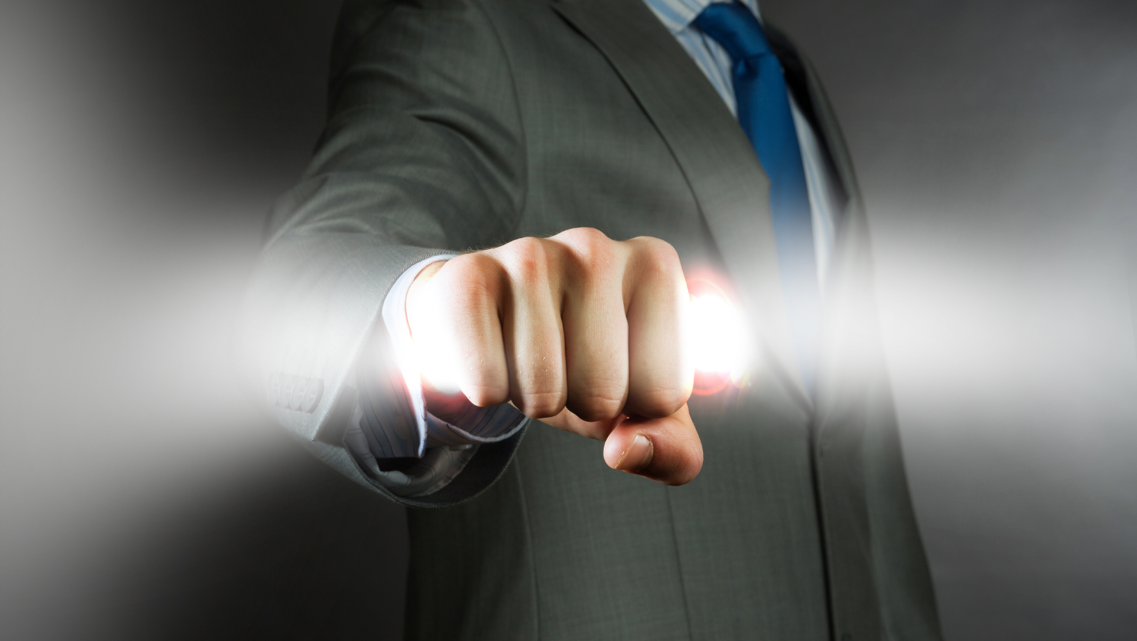 Business professional reaching forward, symbolizing power, influence and leadership.